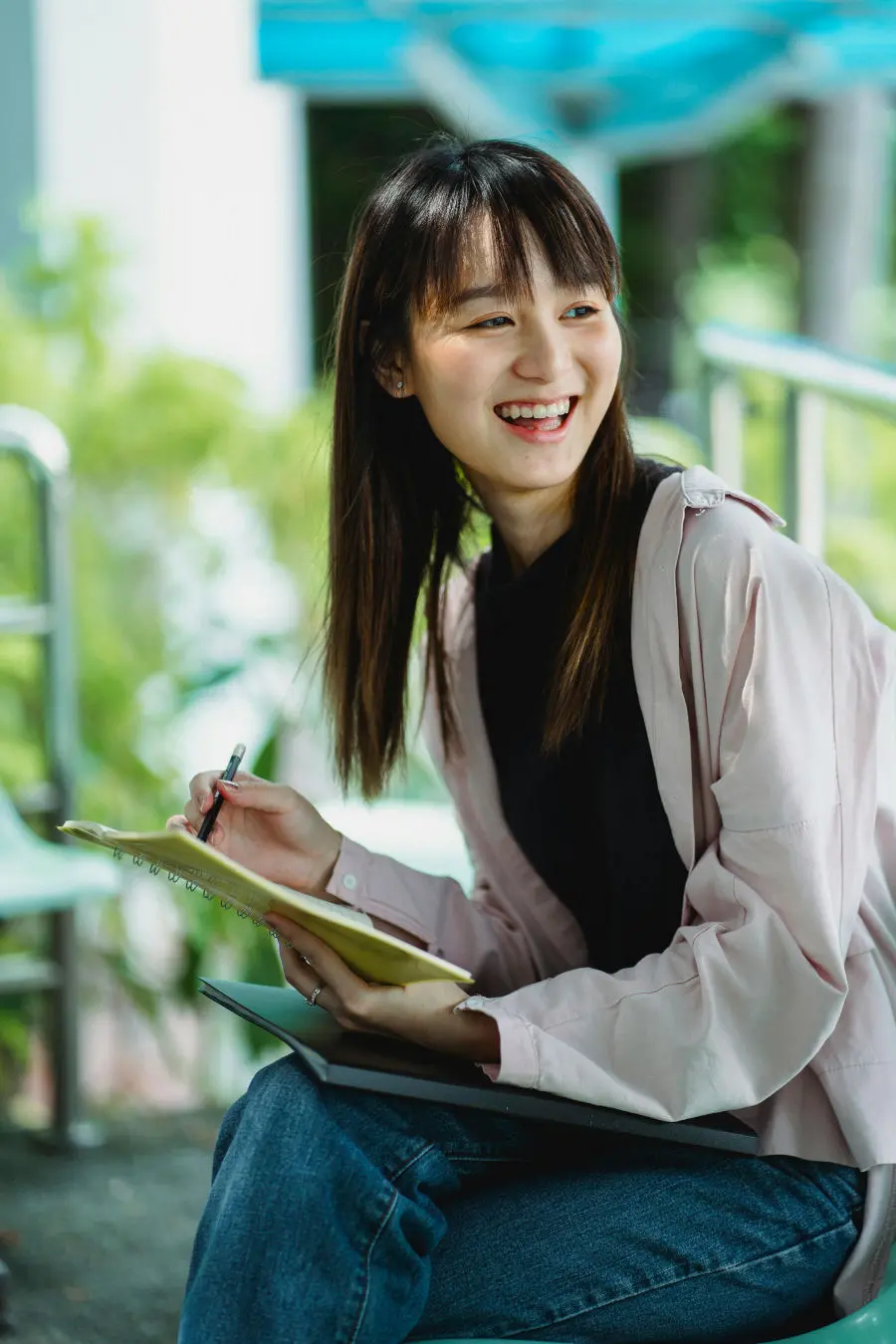 O3 ReBoot Therapy FAQ Woman smiling with a notepad