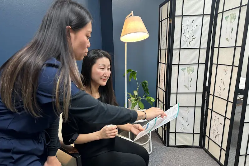 Anna and staff talking